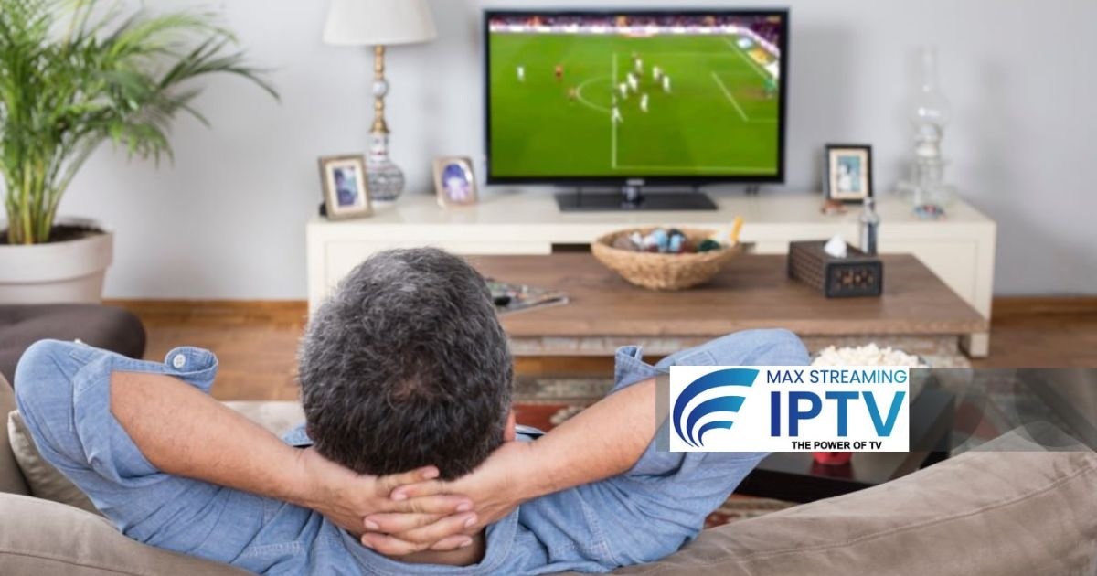 Man relaxing on sofa watching TV with remote control